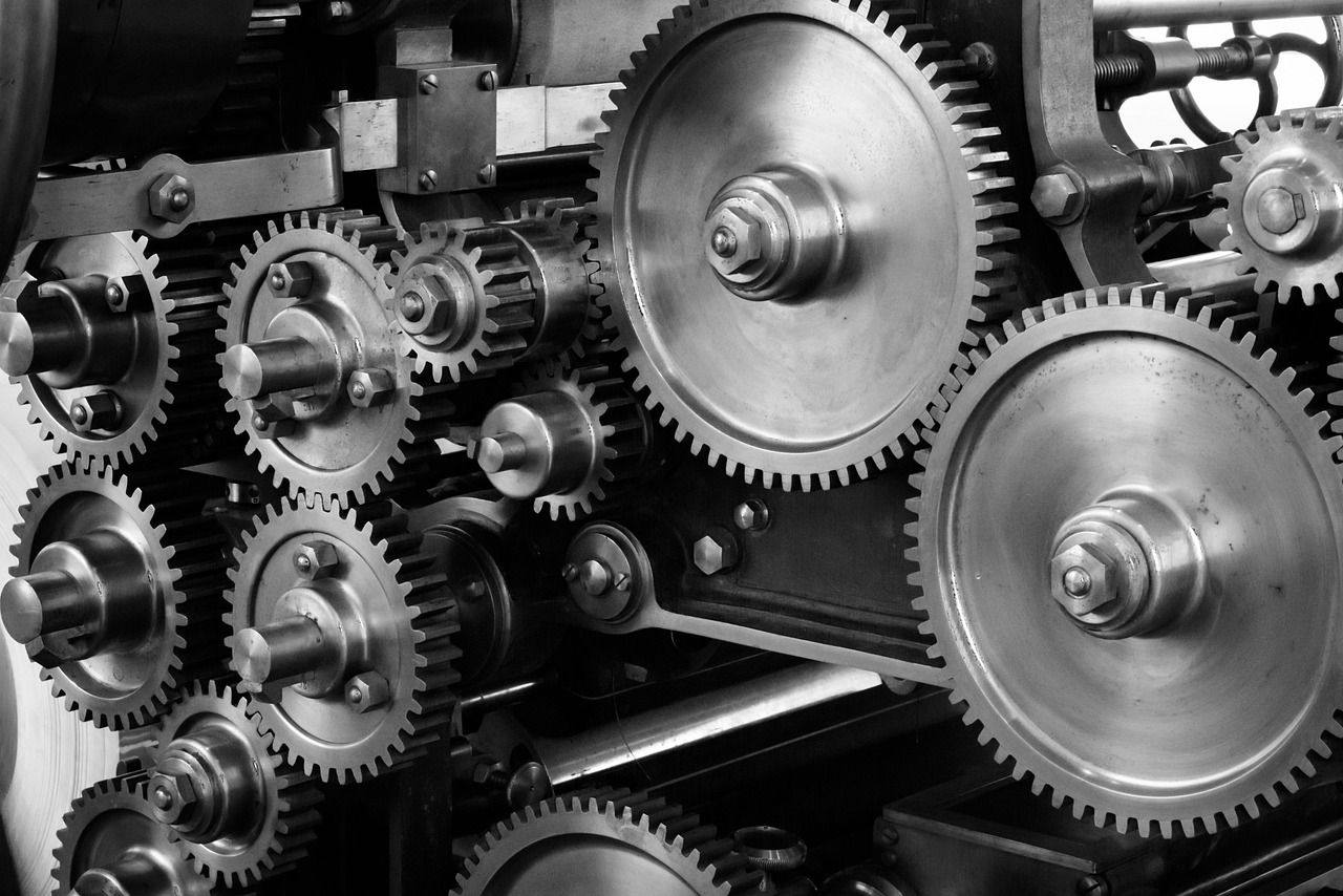 Close-up of interlocking metal gears inside a machine